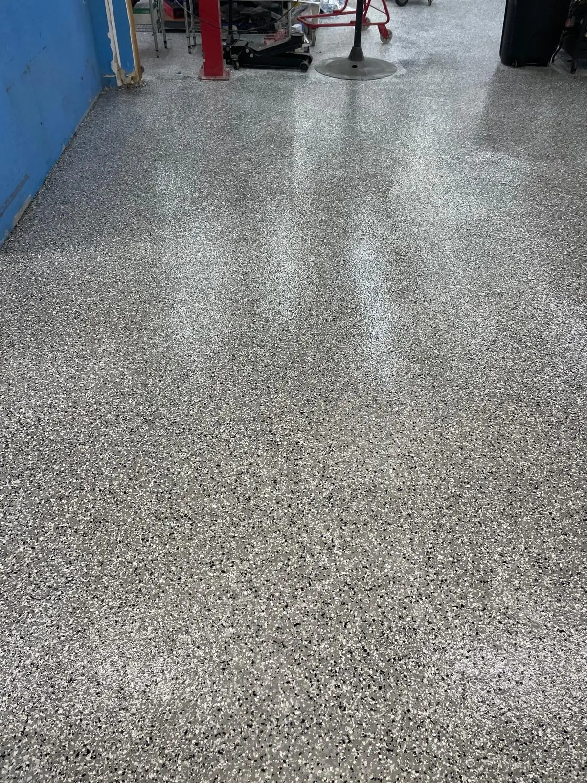 GT Motorworks epoxy floor — After — high-gloss floor finish detail