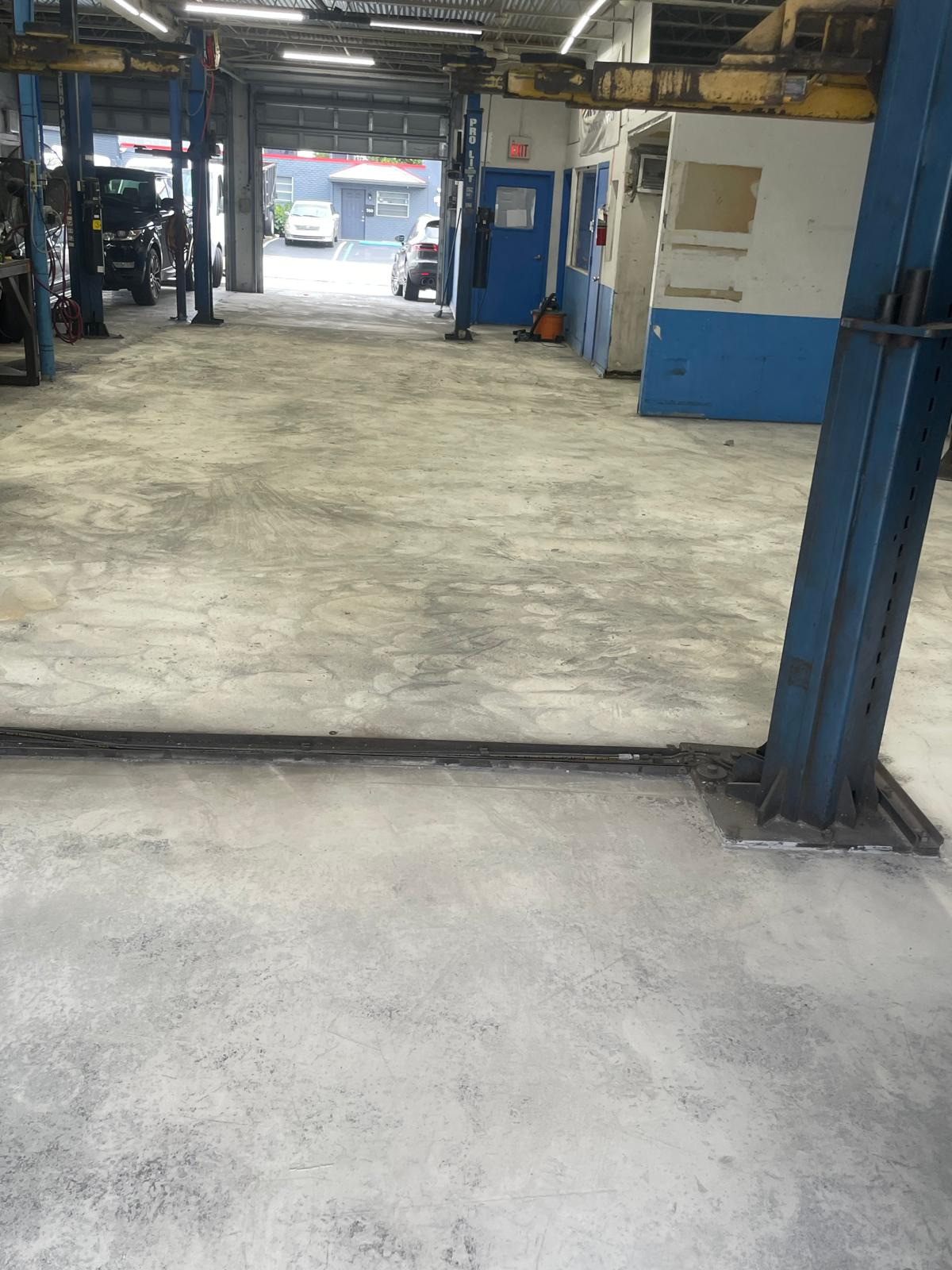 GT Motorworks epoxy floor — Before — existing concrete shop floor
