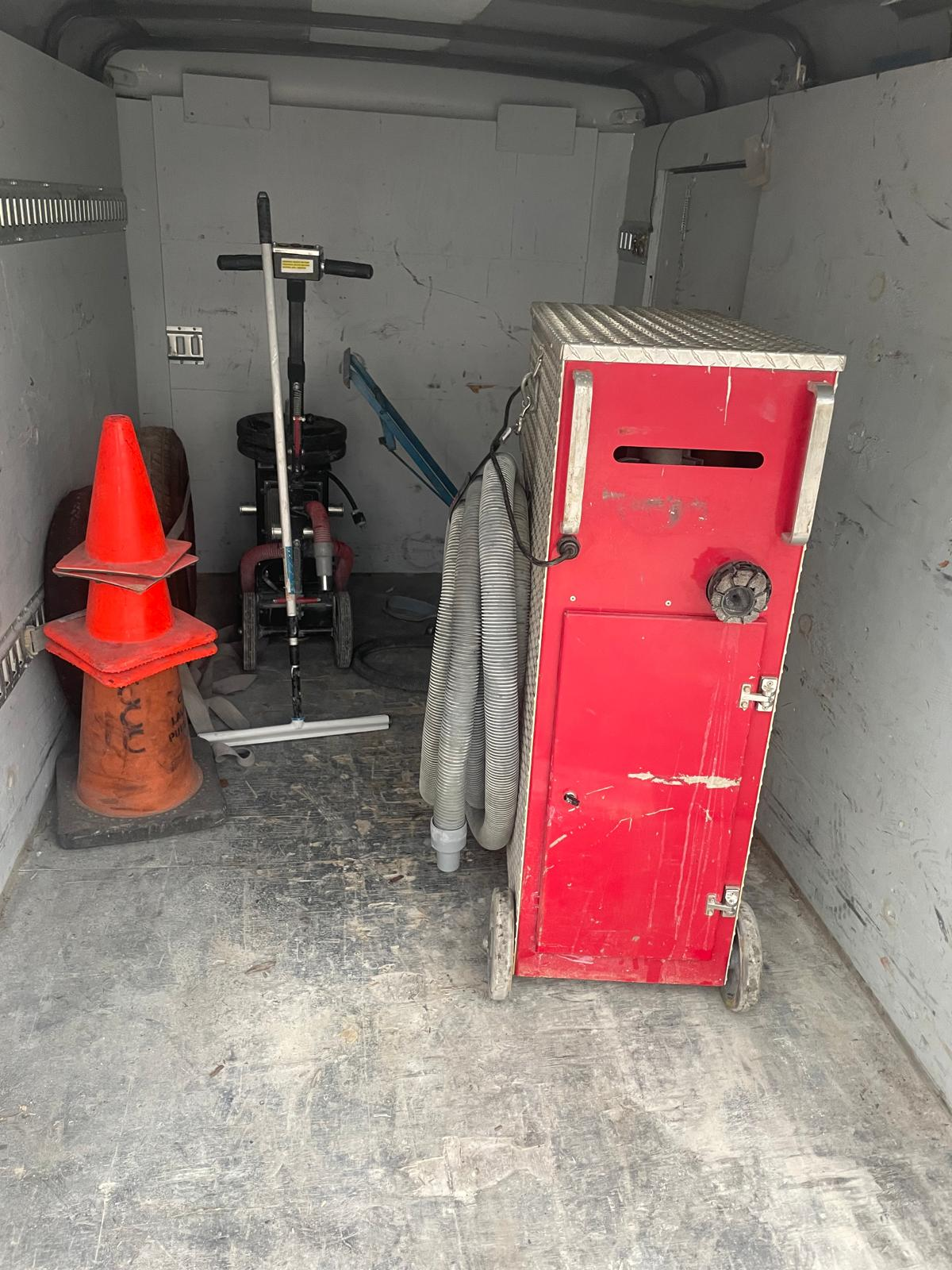 GT Motorworks epoxy floor — Before — professional surface-preparation equipment