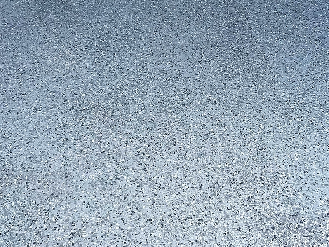 Mrs. C. Garage epoxy floor — Full broadcast flake detail sealed under a clear topcoat