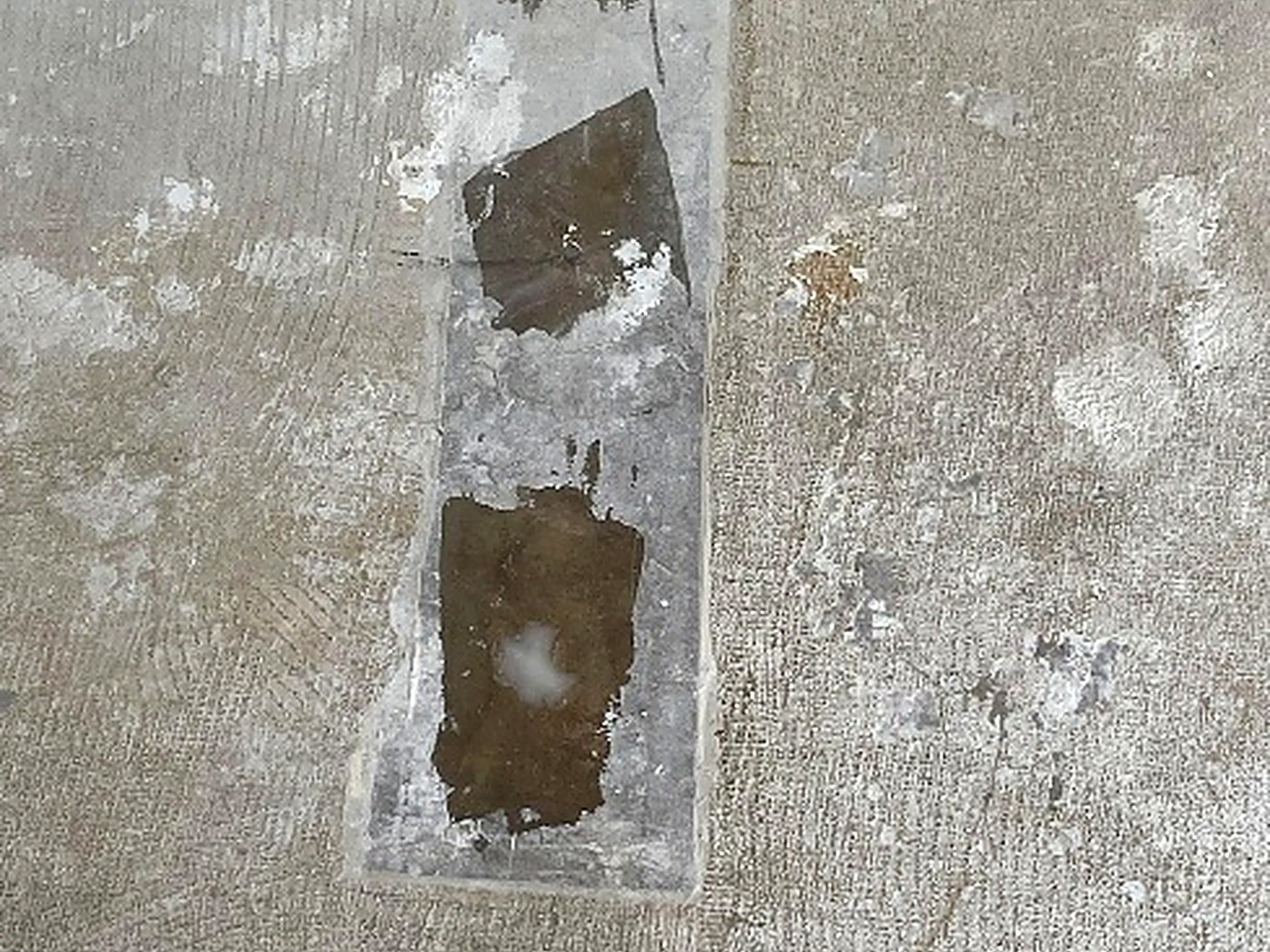 Mrs. C. Garage epoxy floor — Crack and spall repairs filled and leveled before coating